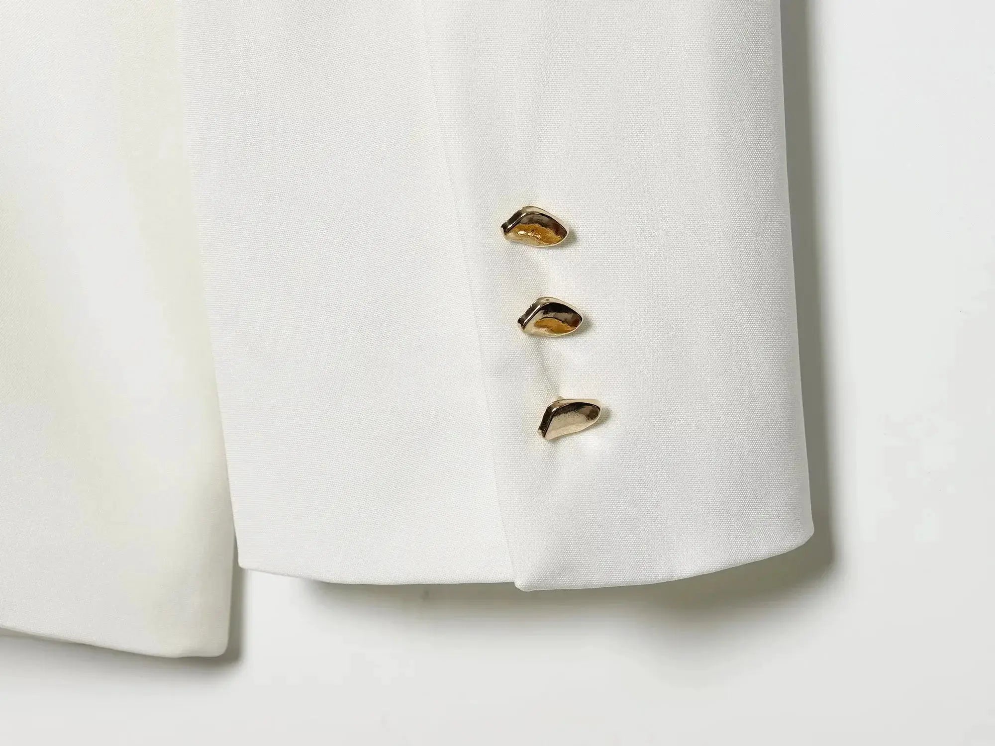 Blazer by Simples Market; white fabric with gold-tone cuff buttons, long sleeve