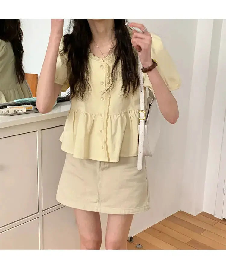 Women's pale-yellow puff-sleeve peplum top with button-down front, paired with beige mini skirt (2-piece outfit).