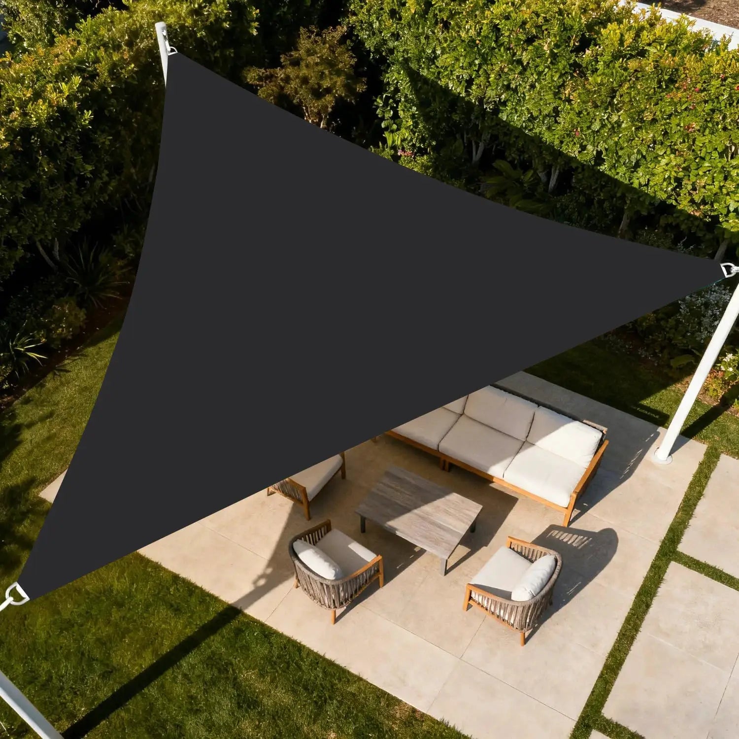 Triangle sun shade sail in dark gray, waterproof UV-block canopy over outdoor patio seating.