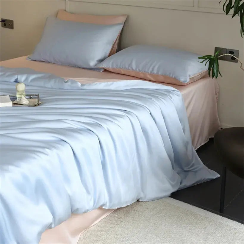 Mulberry Silk Bedding Set by Simples Market; light blue silk duvet cover with matching sheets and pillowcases.
