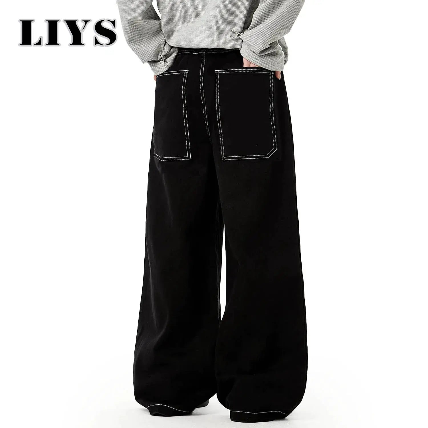 Men's black baggy wide-leg denim jeans by Simples Market with white topstitching and large back pockets.