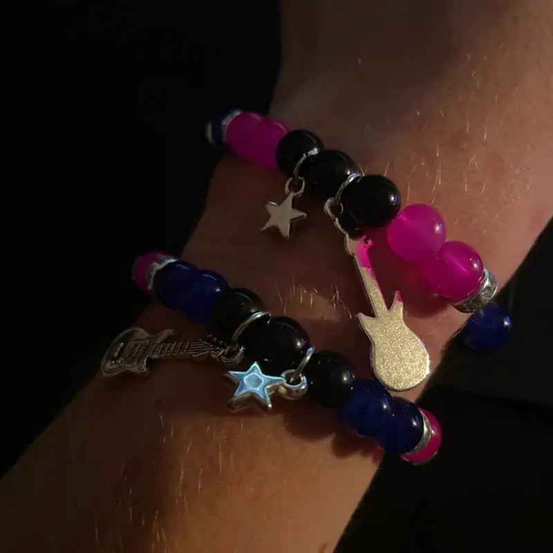 2-pc beaded couple bracelets with star and guitar charms, pink/black and blue beads