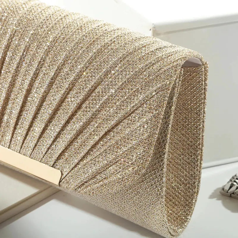 Simples Market gold sequined evening clutch bag with chain strap.