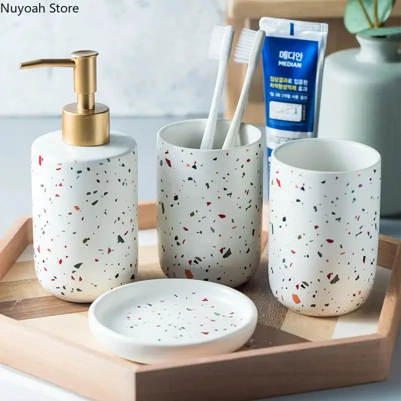 Simples Market European terrazzo ceramic bathroom set: white speckled soap dispenser, toothbrush cup, tumbler, and soap dish.