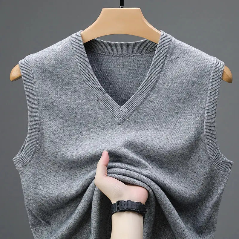 Men's grey knit V-neck sleeveless sweater vest on hanger, warm casual outerwear
