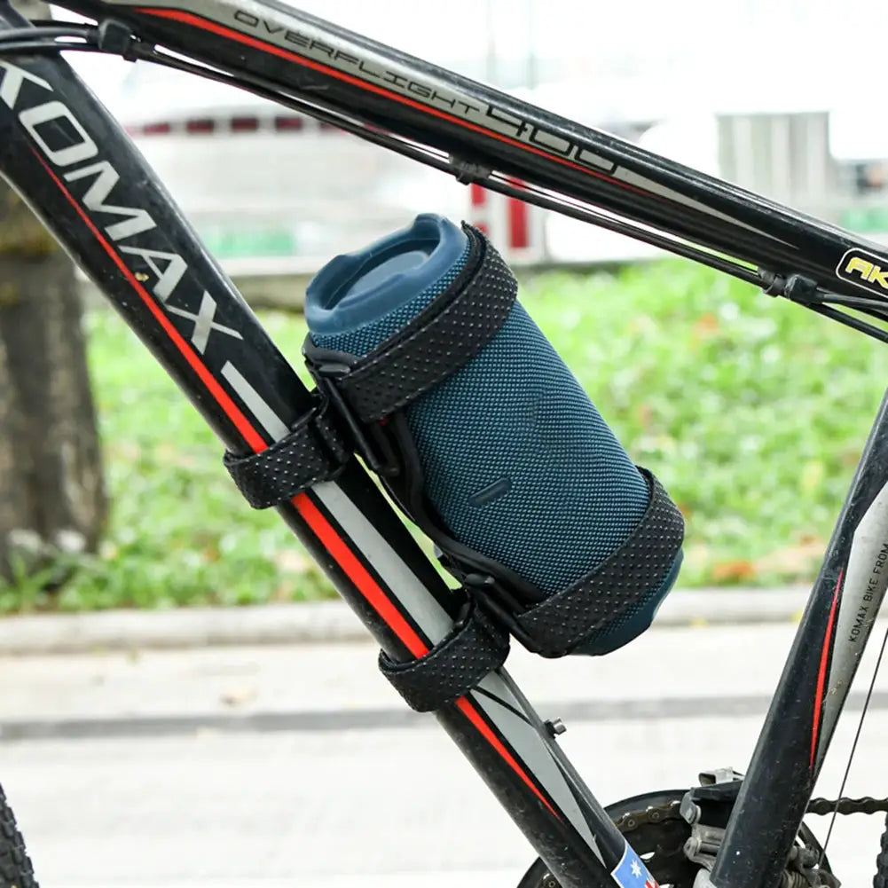 Bike speaker holder mount with adjustable straps; blue portable speaker attached to a black/red bicycle frame