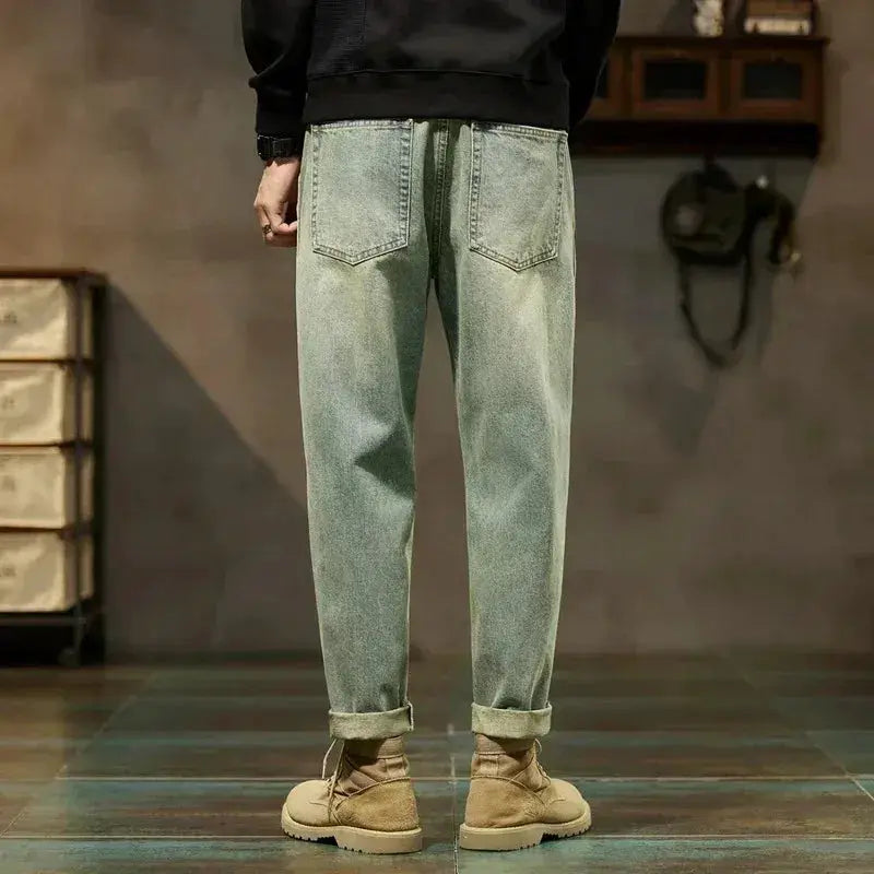 Men's loose denim harem pants, Harajuku-style straight fit with a light wash and rolled cuffs.