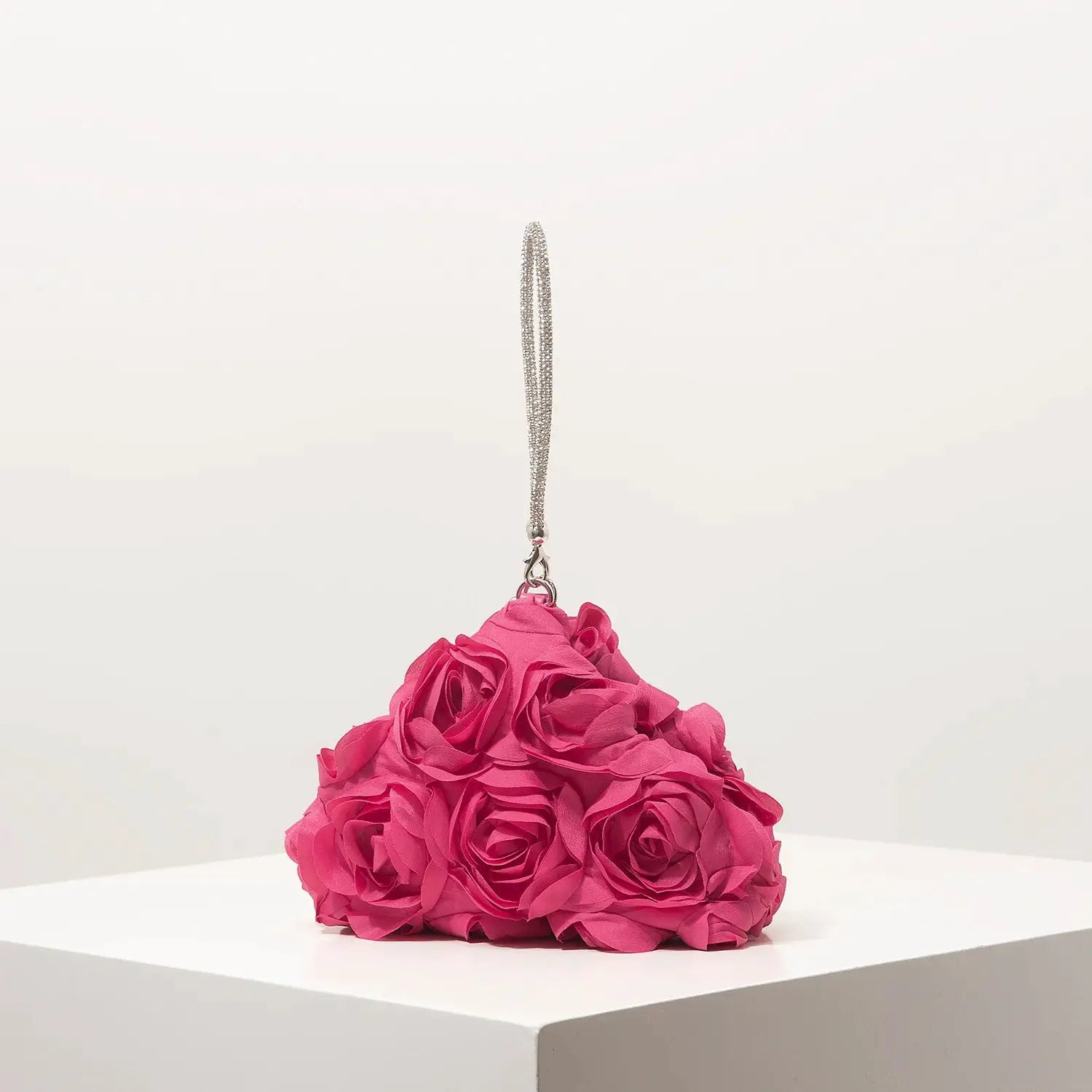 Mini pink floral rosette purse with a silver chain strap