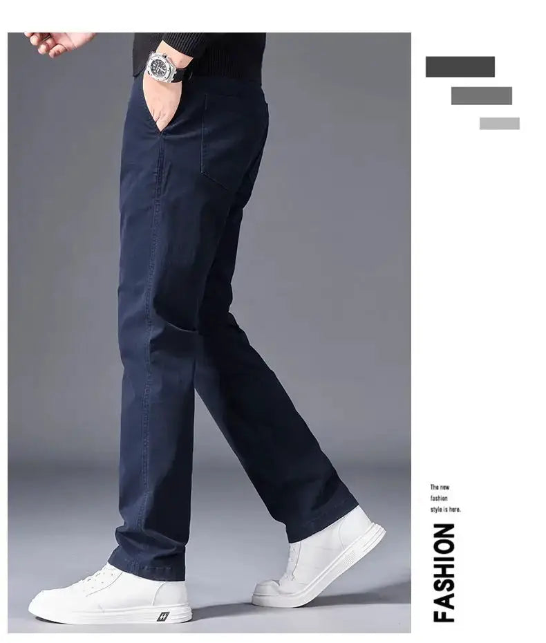 Men's navy cotton pants, straight-leg casual business trousers with side pockets, paired with white sneakers.