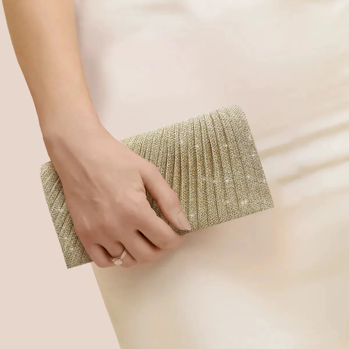 Gold glitter envelope clutch by Simples Market, shimmering evening bag with pleated texture.