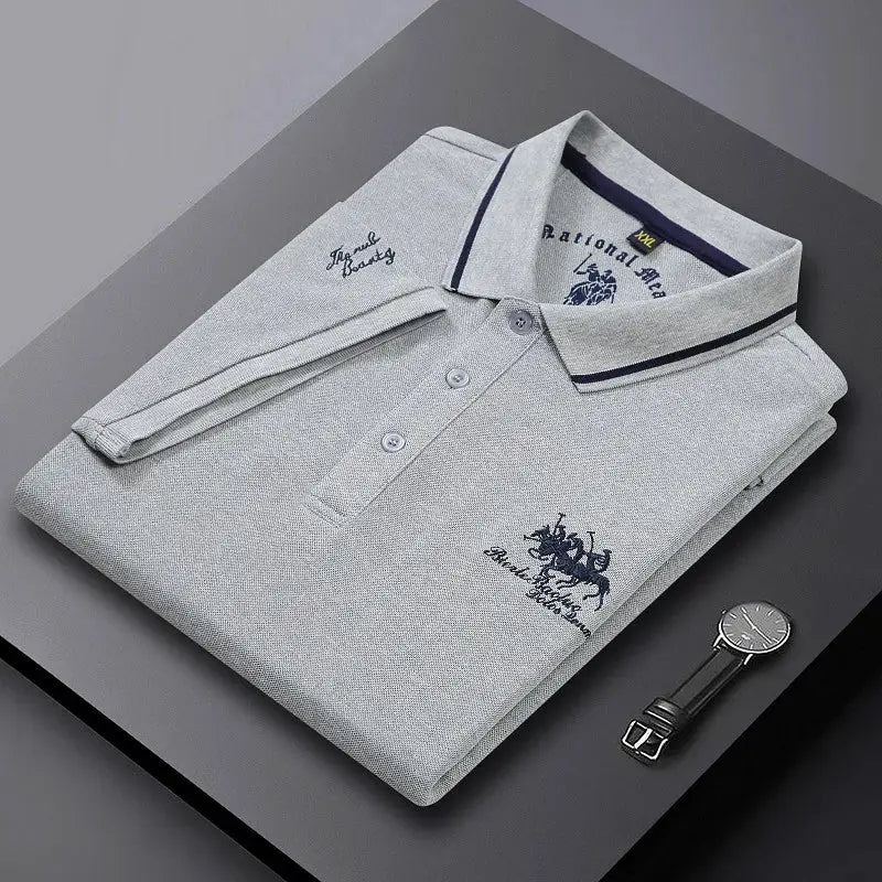 Men's light gray polo shirt with embroidery, navy-trim collar and short sleeves