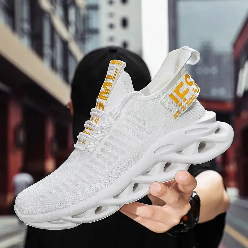 White unisex running sneaker with breathable mesh and yellow pull tabs, sculpted hollow sole