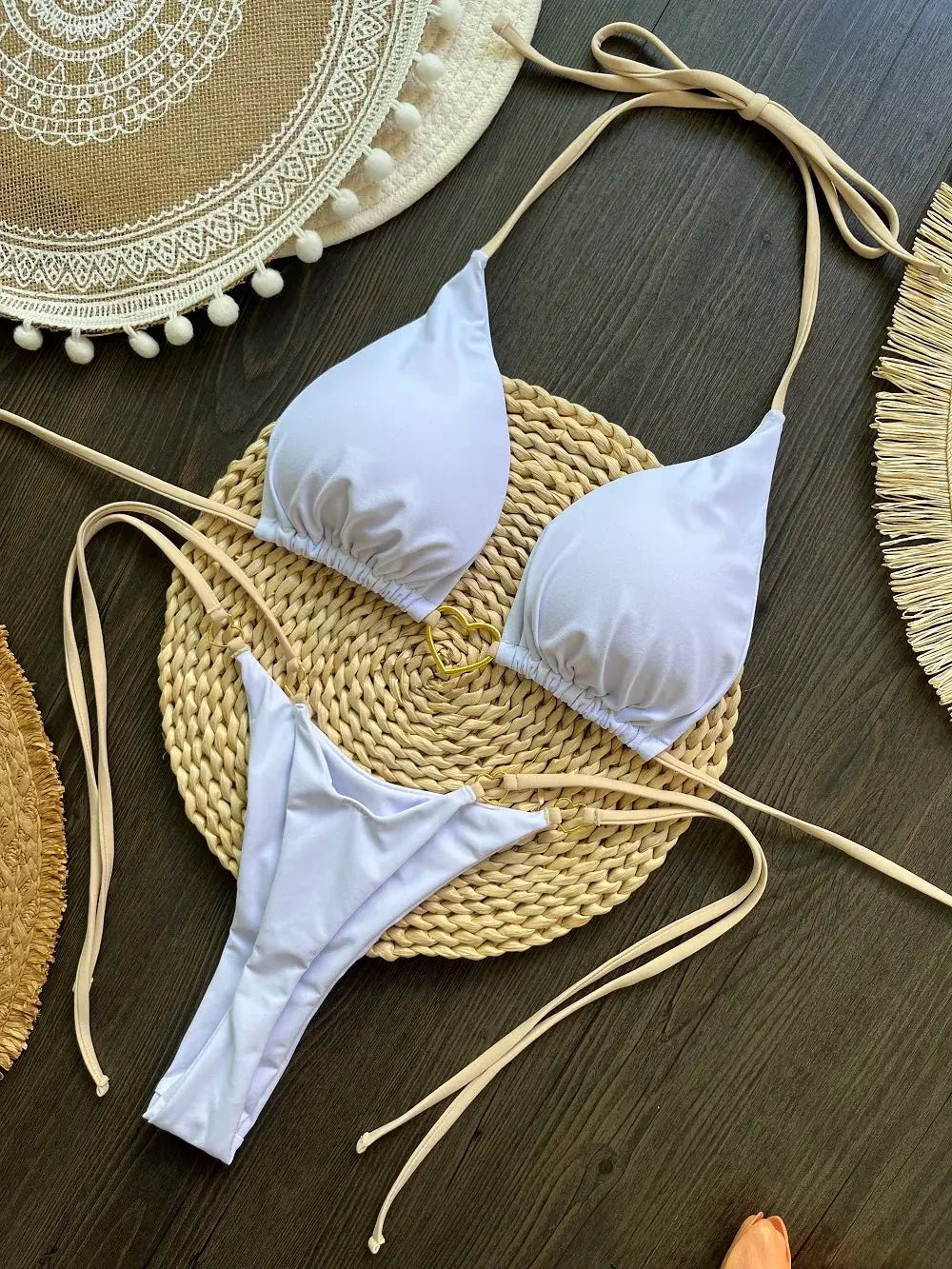 RUOTONSEPT lavender bikini set from Simples Market, halter top with gold ring detail and thong bottoms on woven mat