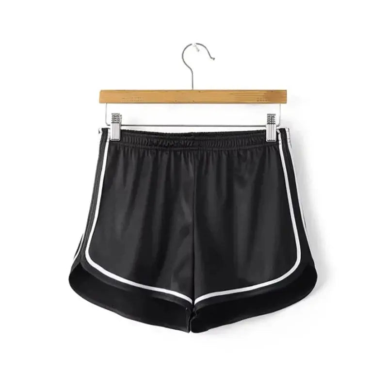 Women's black silk shorts with white piping, elastic waistband, curved hems by Simples Market