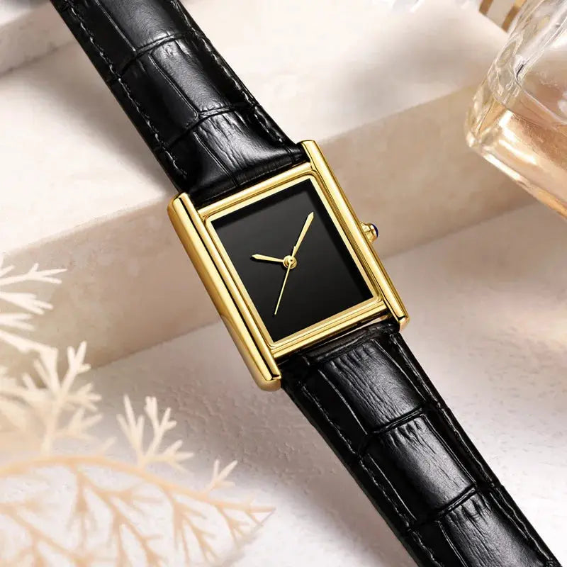 Unisex watch with gold-tone rectangular case, black dial, and black leather strap
