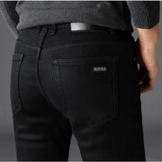 Men's black denim jeans with back pockets and small brand label