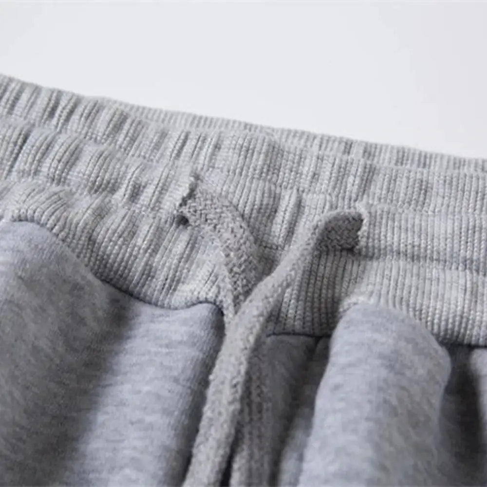Mens grey fleece jogger pants with drawstring waistband, long length