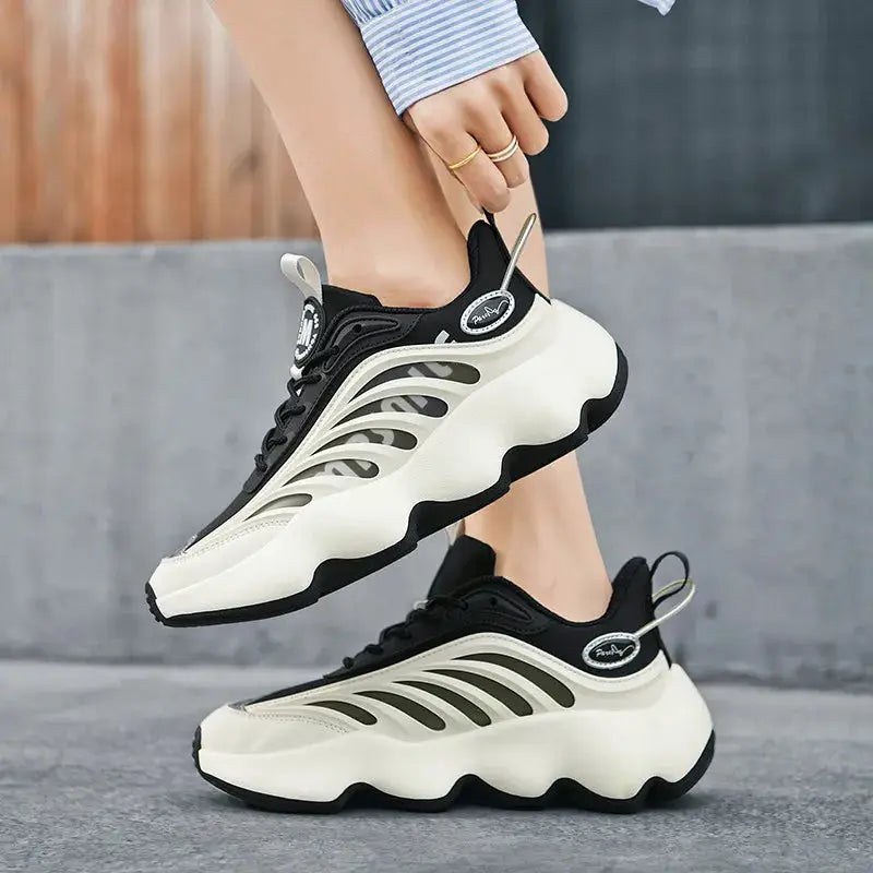 Simples Market men’s black and white sneakers, a pair with breathable side panels and a chunky wavy sole