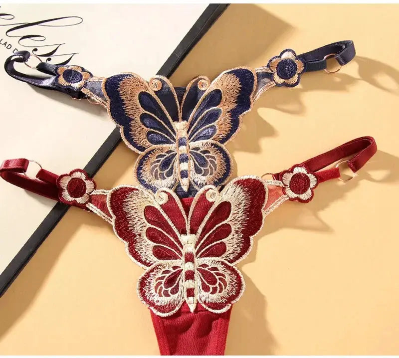 Two Simples Market butterfly lace thongs in navy and red with embroidered butterfly design and adjustable waist.