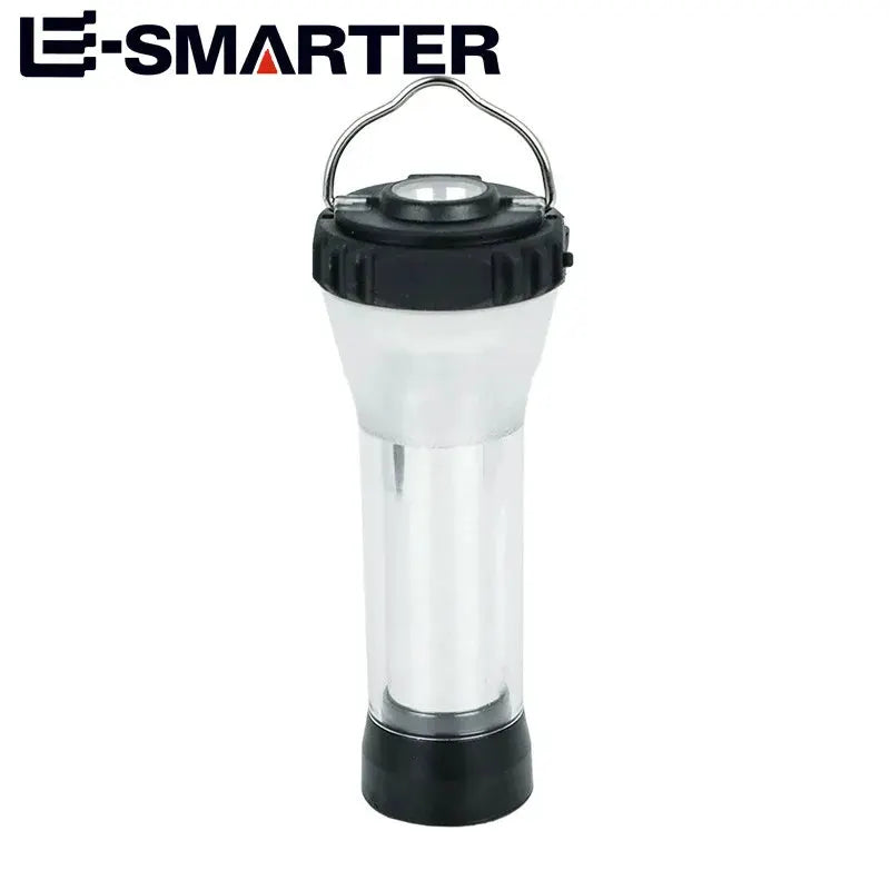 Portable camping lantern by Simples Market with E-SMARTER logo, black top and base, clear cylindrical body.
