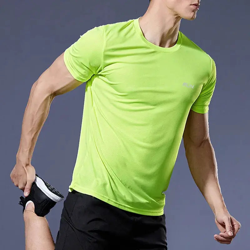 Men's neon lime green running shirt with short sleeves; quick-dry, compression athletic tee.