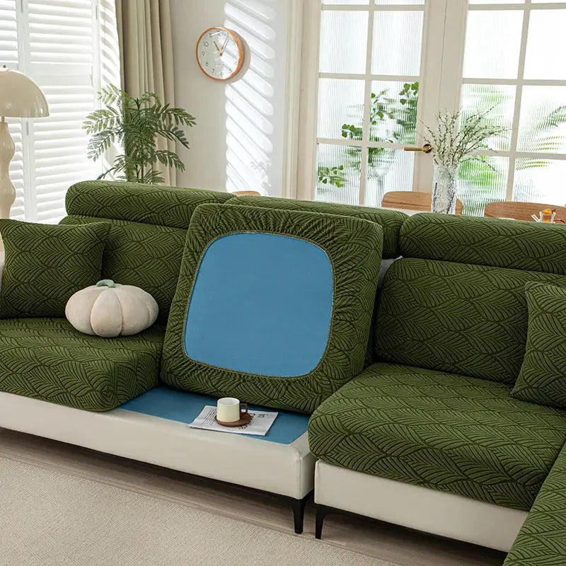 Elastic sofa cushion cover set in thick plush green leaf-pattern fabric with blue panel accents for living room furniture