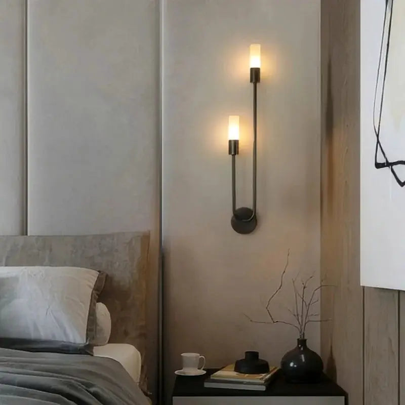 LED black metal double-arm wall lamp with frosted glass cylinders; modern minimalist sconce.