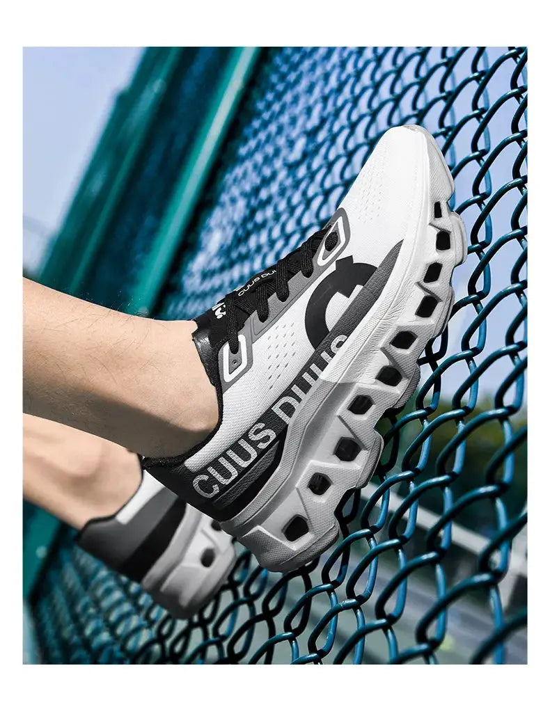 Pair of men's running shoes with breathable white mesh uppers, black accents, and chunky hexagonal outsole pods.