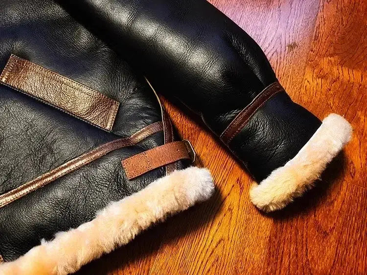 Men's black leather B3 shearling jacket with tan fur trim and cuffs