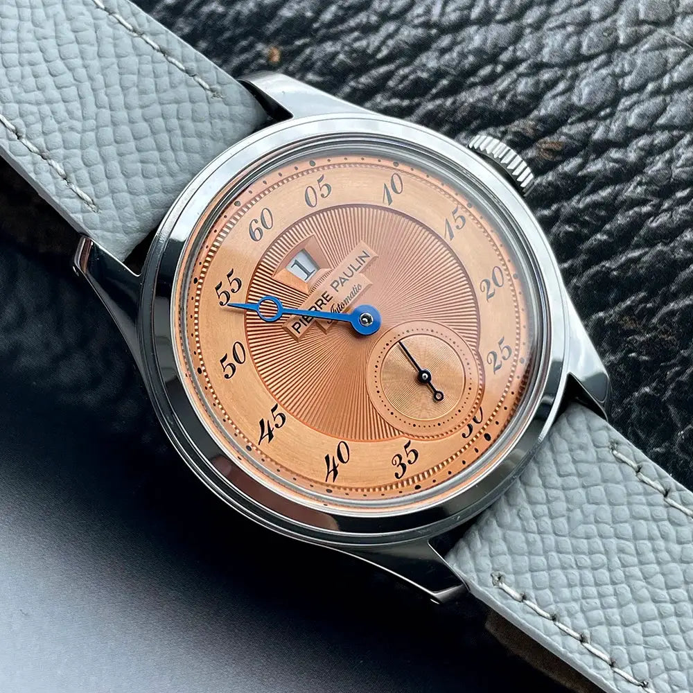 Pierre Paulin Jumping Hour men's watch with salmon dial, blue hands, date window, 38mm case, gray leather strap