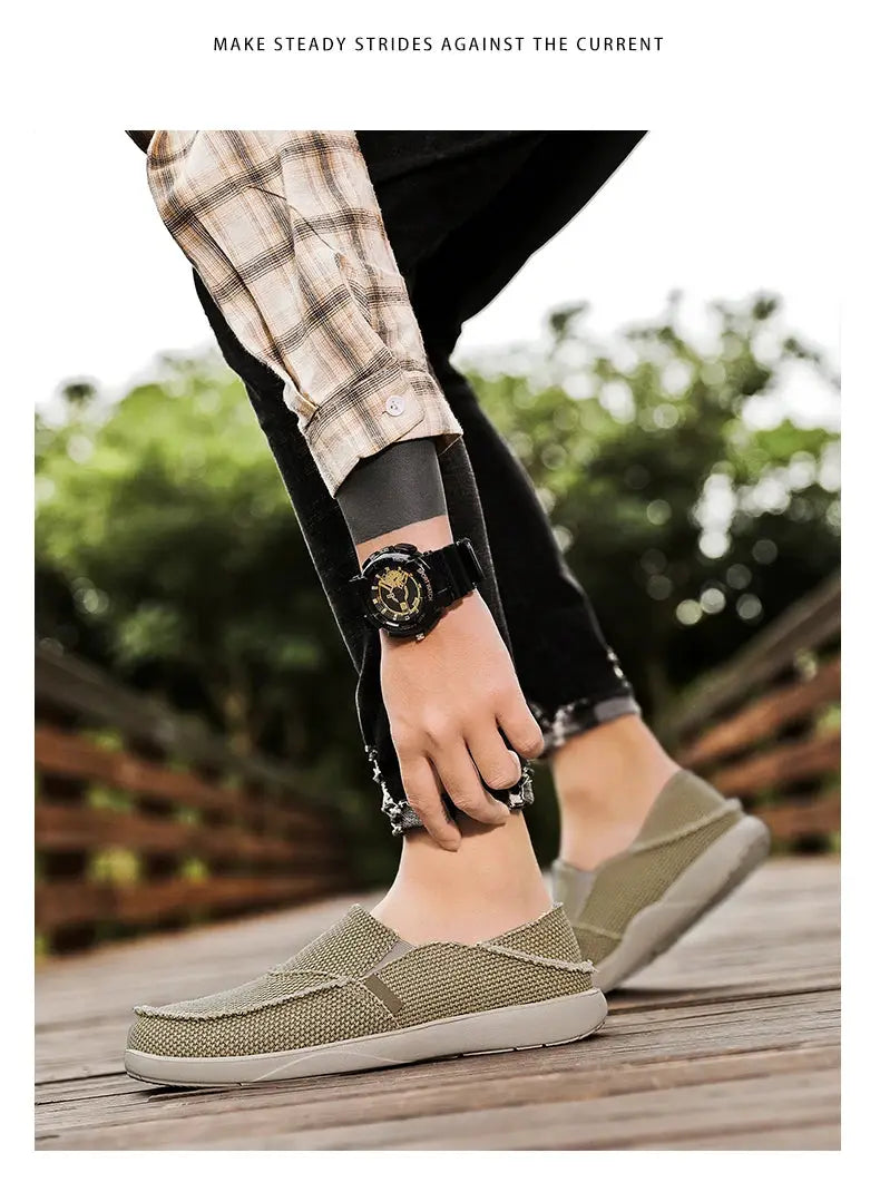 Men's olive canvas slip-on loafers with breathable mesh texture, lightweight casual shoes
