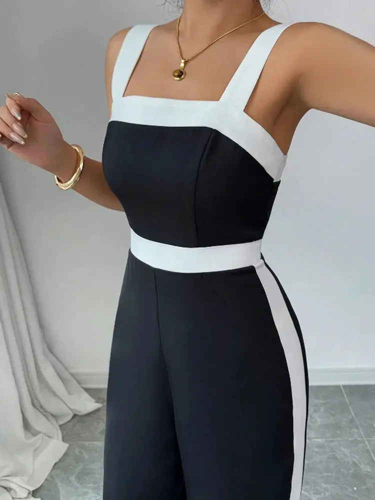 Simples Market Women's black and white jumpsuit with square neck and contrast trim, ideal for evening events.