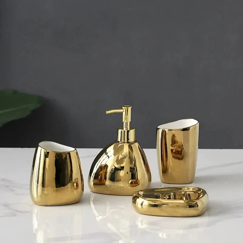Simples Market gold 4-piece bathroom accessory set: soap dispenser, mouthwash cup, toothbrush holder, and soap dish