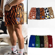 Men's quick-dry sport shorts by Simples Market with TP logo; tiger, giraffe, zebra prints and solid color options.