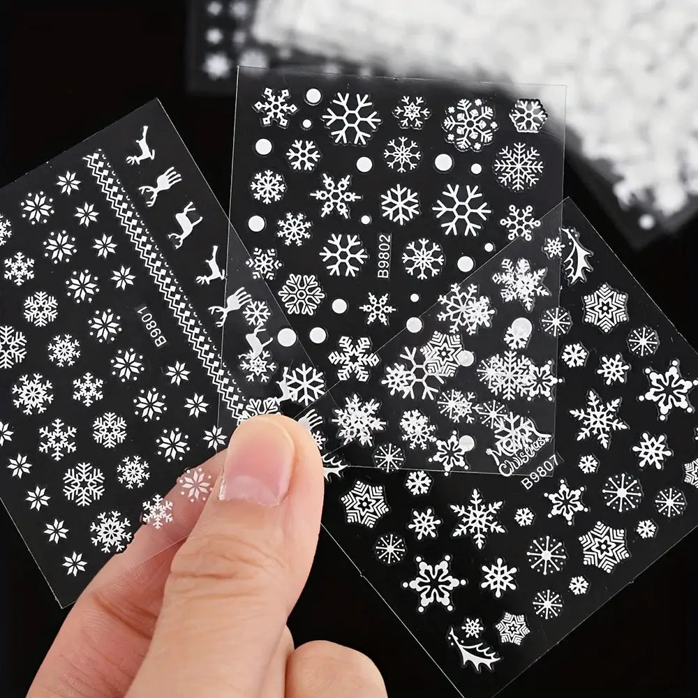 30pc Christmas nail art sticker sheets by Simples Market with white snowflakes and snowmen on black backing, self-adhesive