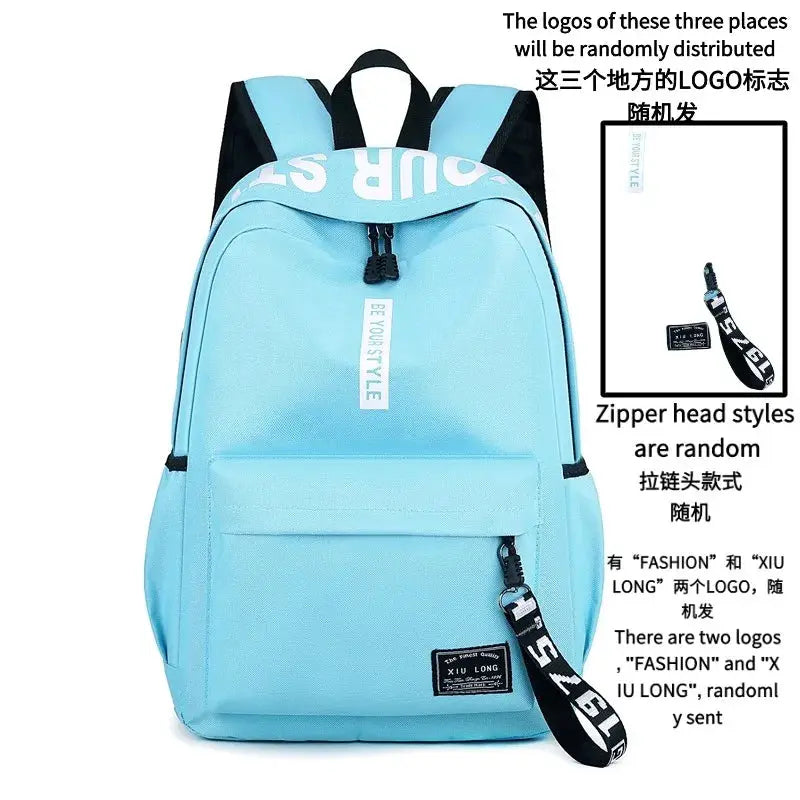 Light blue fashion backpack with large main compartment, front zip pocket, and black adjustable straps.