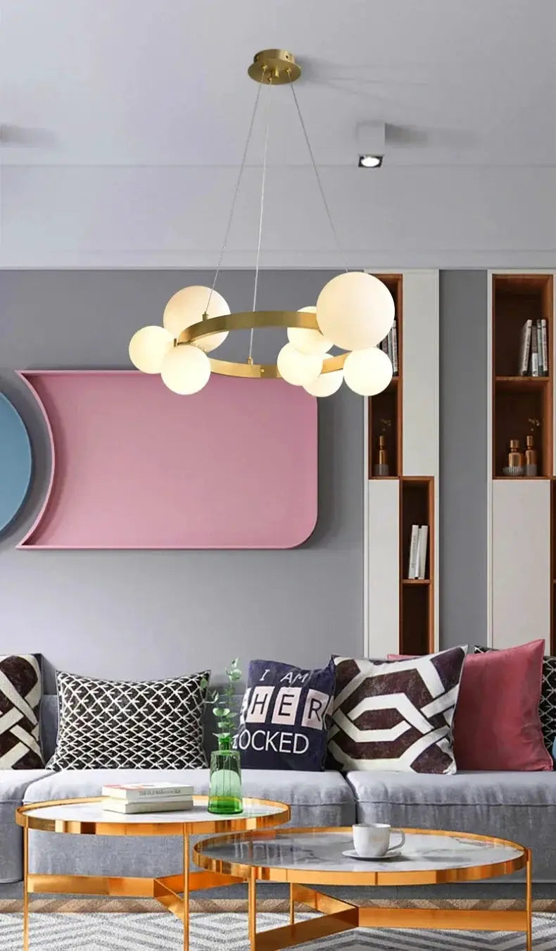 Simple chandelier hanging lamp with gold circular frame and multiple frosted globe bulbs