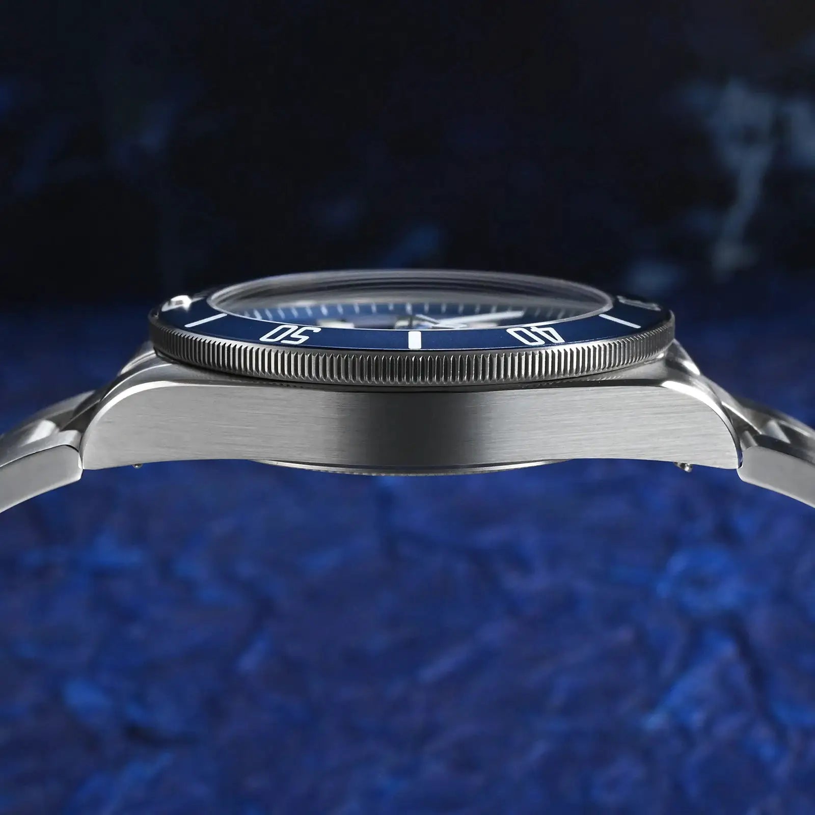 Watchdives WD1969 Pro 38mm quartz watch with blue bezel and stainless steel bracelet