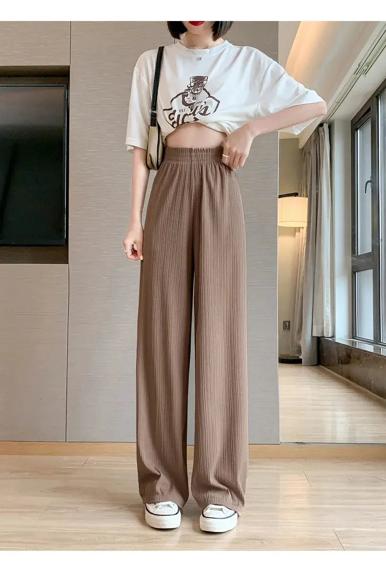Wide-leg pleated brown pants for women with elastic waist, full-length casual trousers.