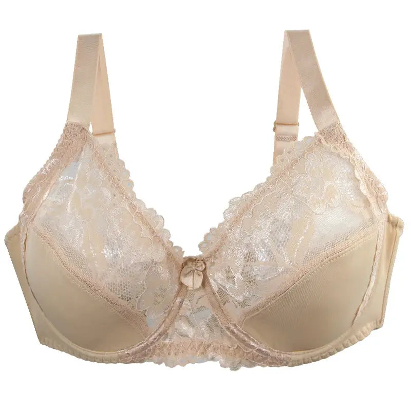 Beige lace underwire bra with scalloped cups, adjustable straps, and small center bow