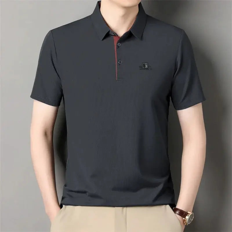 Men's charcoal polo shirt by Simples Market; chest badge.