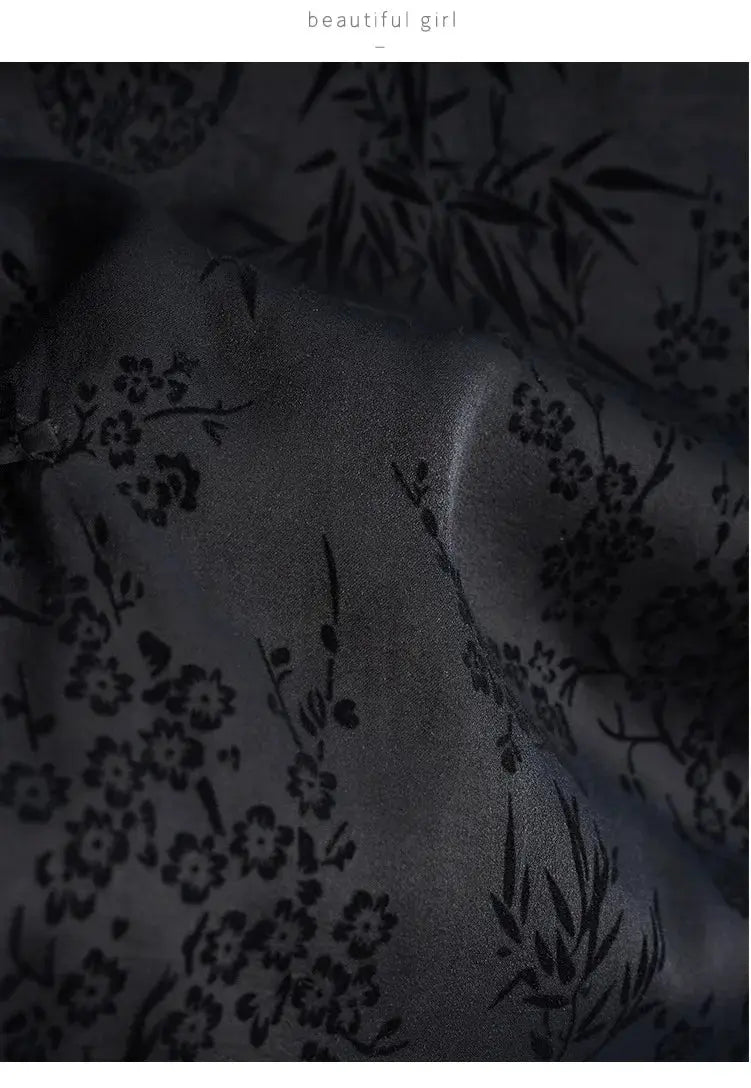 Cheongsam-style black jacquard top fabric with floral pattern close-up