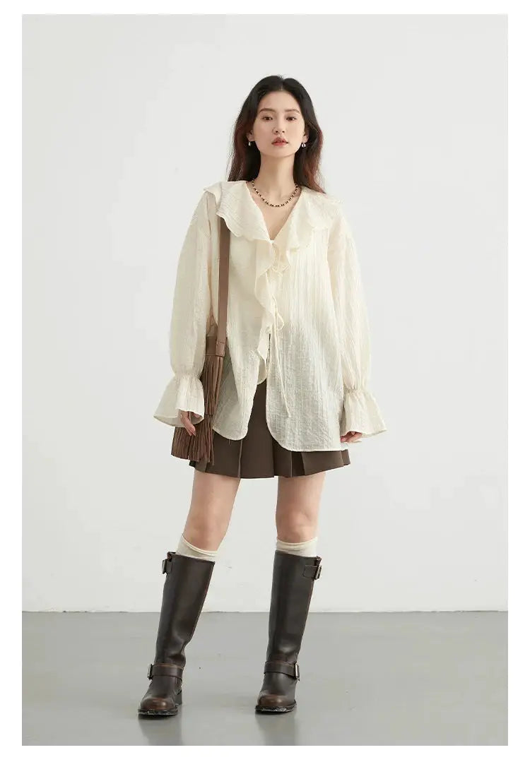 CHIC VEN women's cream blouse with loose fit, long sleeves with ruffled cuffs, V-neck and lace-up front.