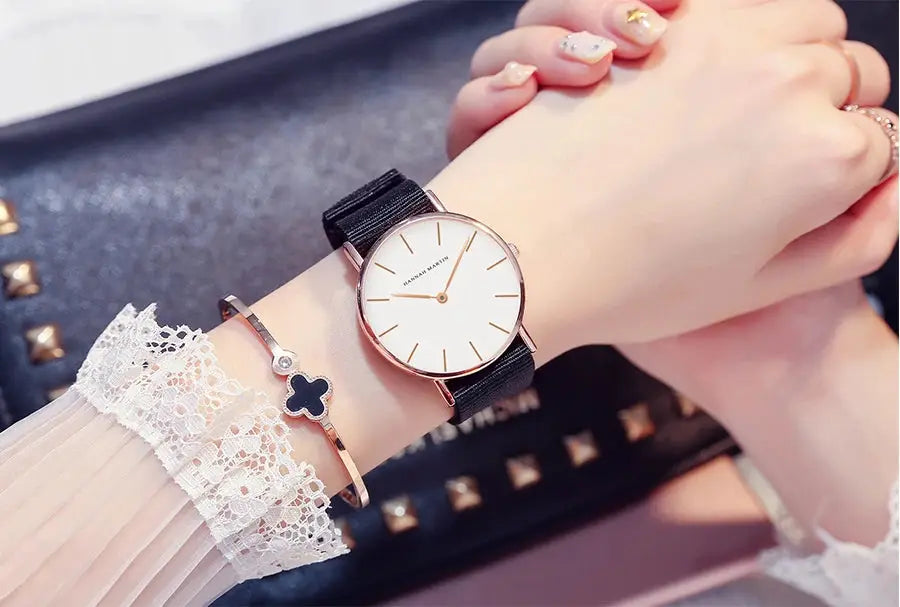 Hannah Martin women's wrist watch, rose-gold case with white dial and black leather strap; two bracelets