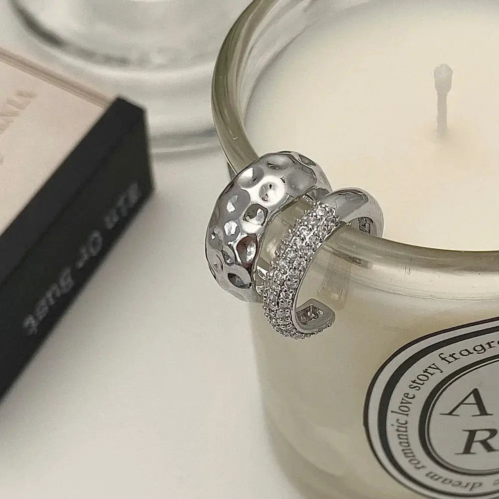 Two-piece ear bone clip set by Simples Market in silver-tone metal with hammered ball texture and pave rhinestone band