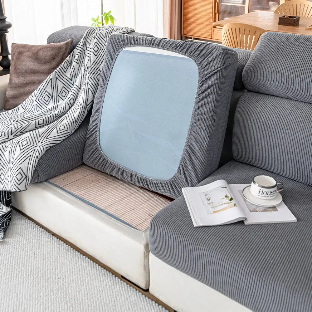 Thick gray jacquard sofa cushion cover with a light-blue center panel on a sectional couch.