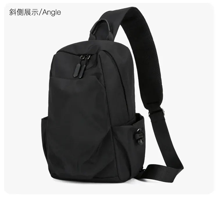 Men's black canvas Oxford cloth chest bag with crossbody strap, dual zipper pulls, and side pockets for everyday use