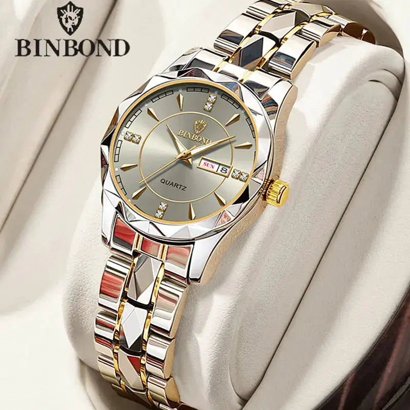 BINBOND women's luxury quartz watch; silver-gold stainless steel band, round dial with gold markers and date display
