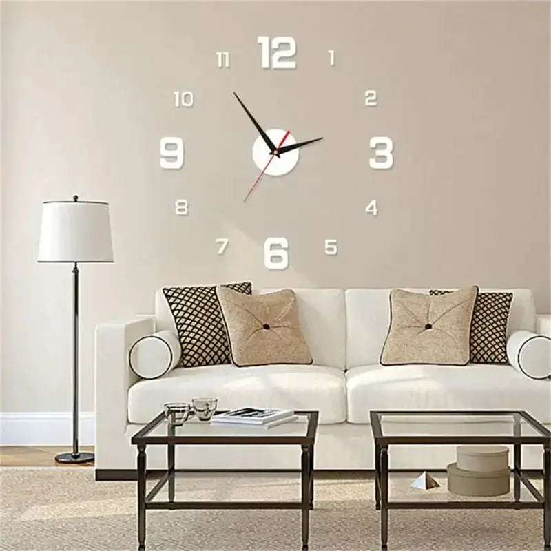 Frameless wall clock with oversized white numerals on a beige living-room wall above a white sofa.