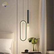 Nordic LED pendant lights: oval illuminated loop and slim black-gold cylindrical pendant, two modern hanging lamps